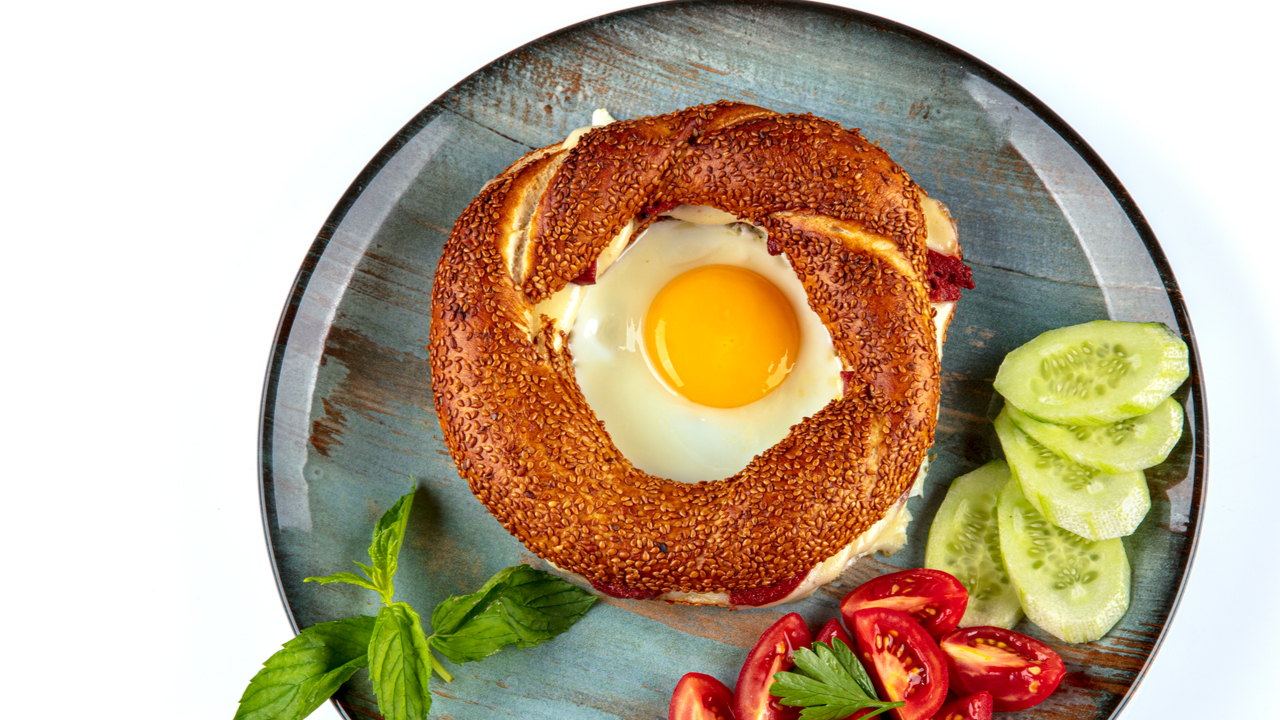 Veggie-topped bagels with poached egg