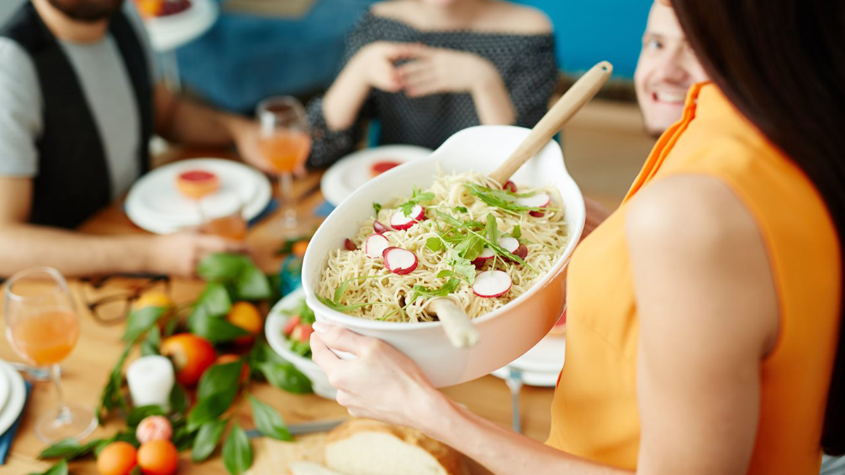 Woman serving a healthy dinner